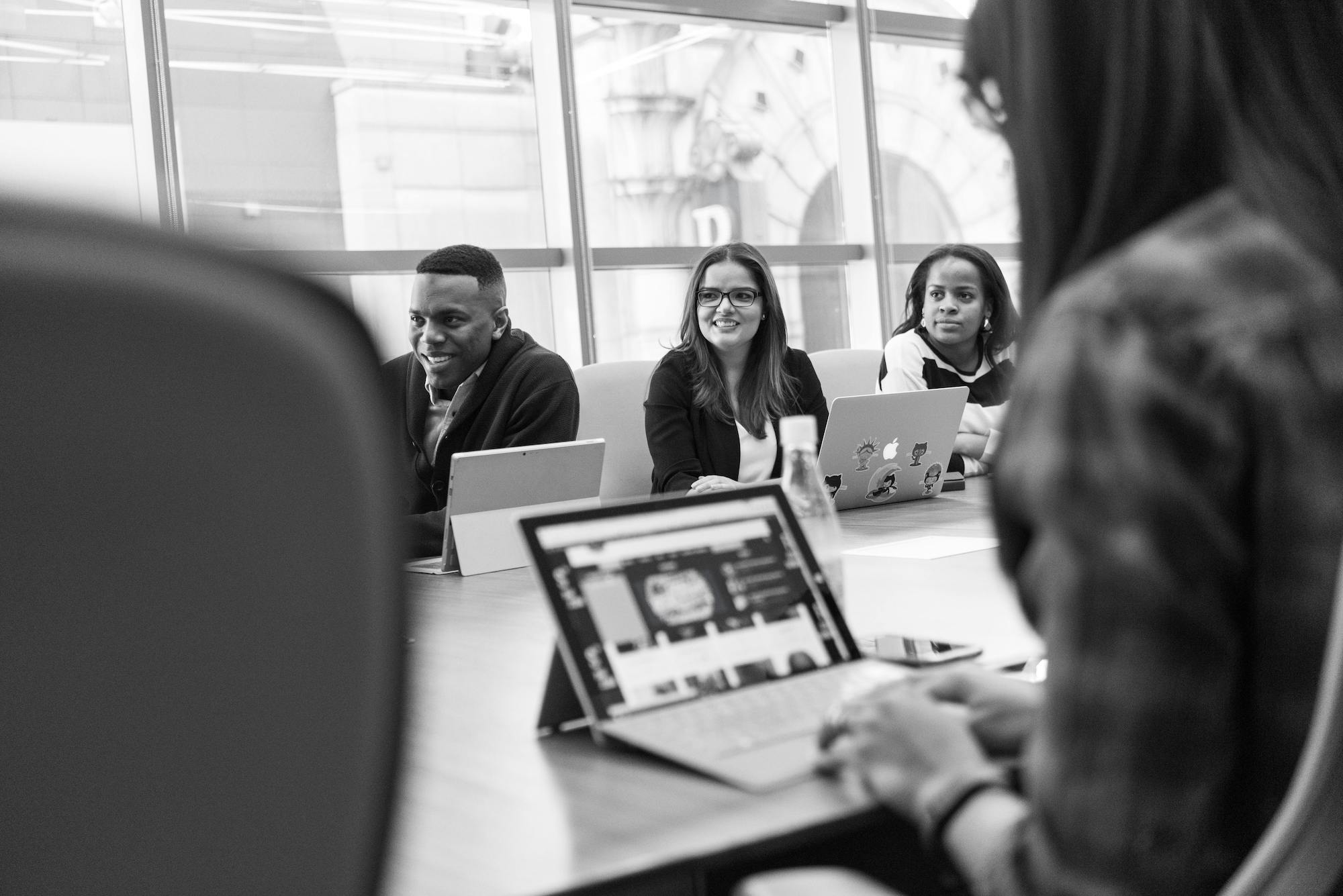 employees meeting at a conference room table